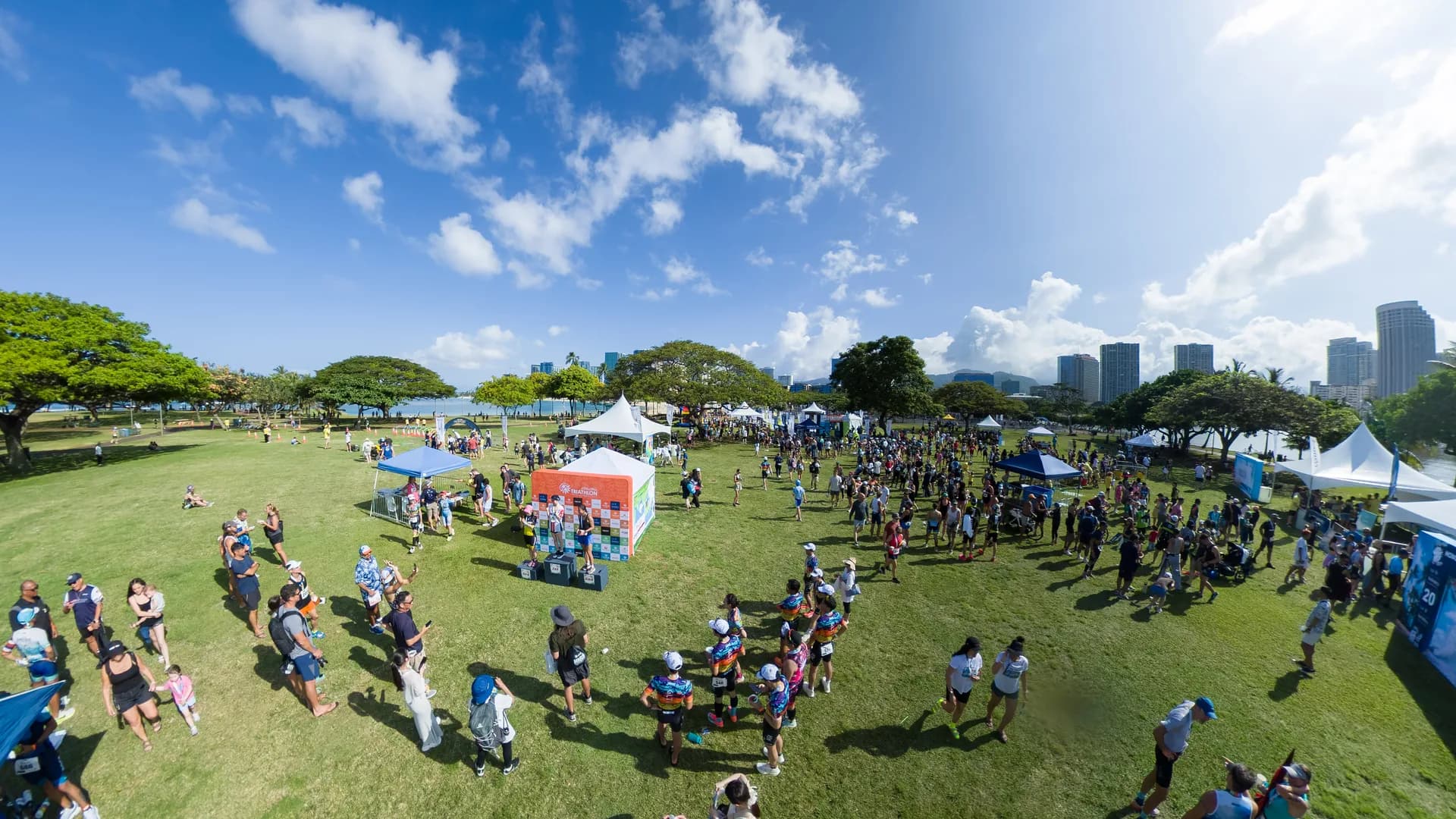An overview of the race village at Ala Moana Beach Park on event day